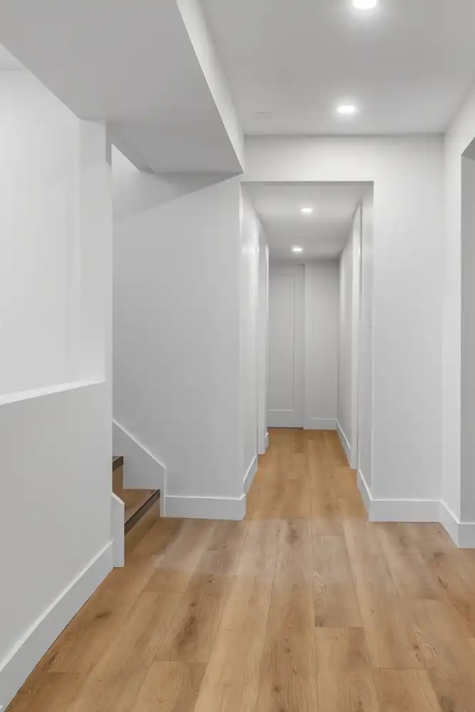 Private hallway and separate entrance circulation in a legal basement suite